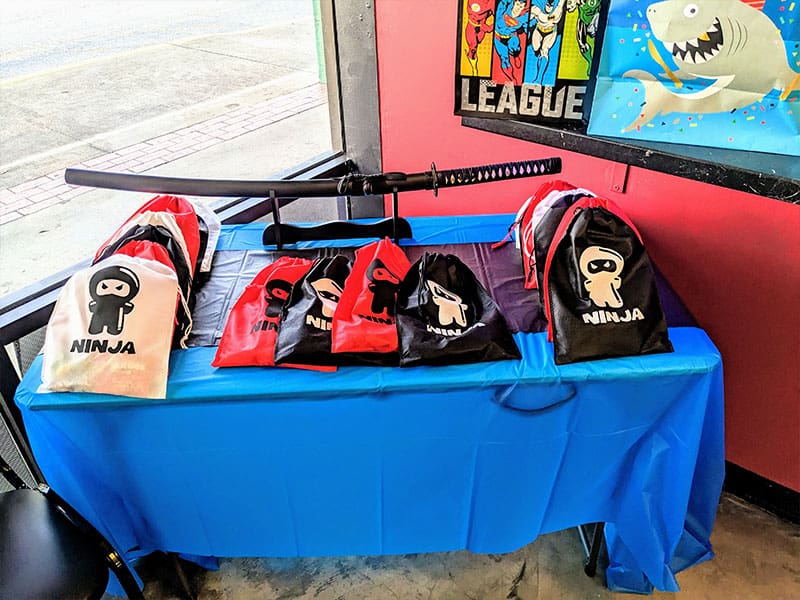 Goodie bags & the sword cake cut
